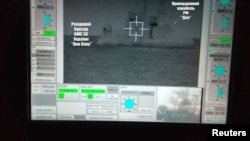 A screen shows a Russian border guard vessel Don trying to stop a Ukrainian Navy tug boat as three Ukrainian ships make a journey from the Black Sea port of Odessa via the Kerch Strait to Mariupol on the Sea of Azov, in the Black Sea, Nov. 25, 2018. (Ukr